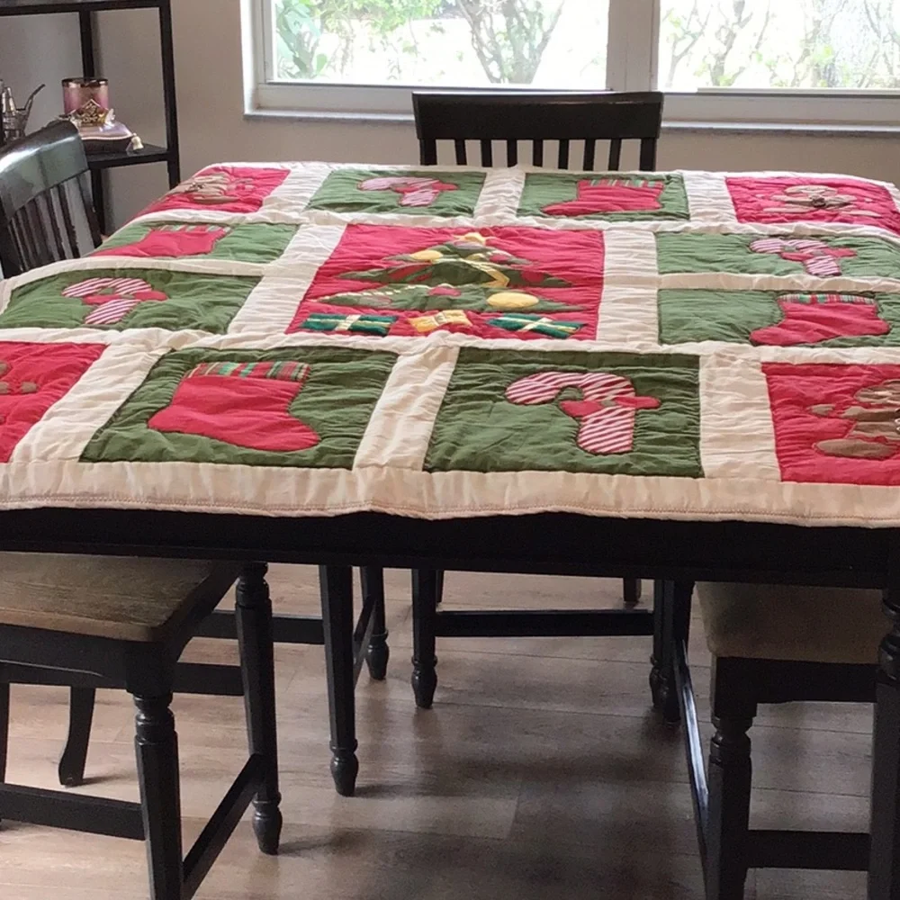 Handmade Christmas-themed applique quilt